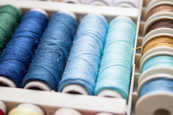 Colorful yarn on spool, yarn on tube, cotton, wool, linen thread.
