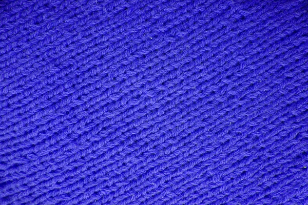 Bakgrund textur Diagonal blått stickat tyg från ullgarn — Stockfoto
