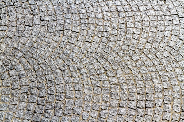 Cobble stones making curved pattern. — Stock Photo, Image