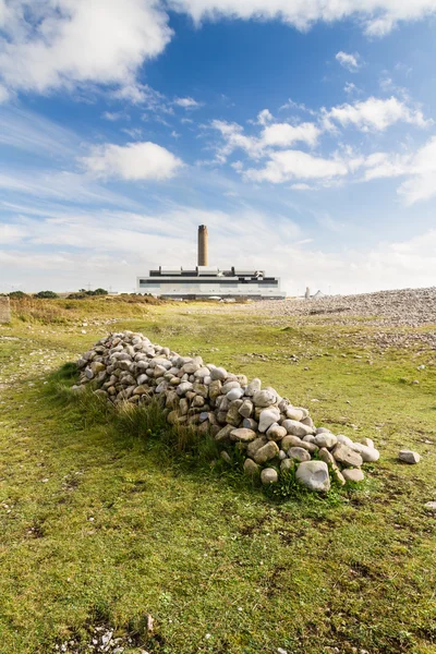 Pile of stones, power station in distance — Stock Photo, Image