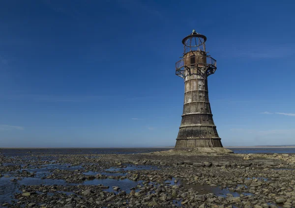 Ruined derelict lighthouse, space to top left. Whiteford Sands, — Stock Photo, Image