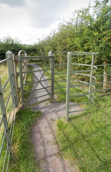 Iron kissing gate in good condition. Type of stile style. — Stock Photo, Image
