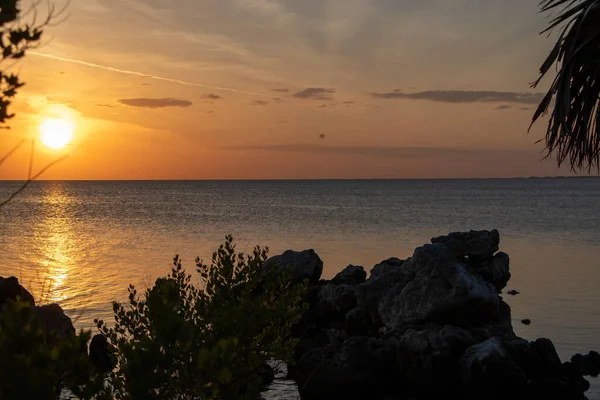 Horseshoe beach jetty at sunset