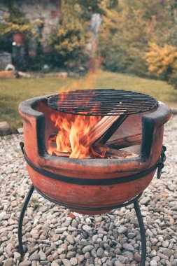 terracotta barbecue pit in italian country house