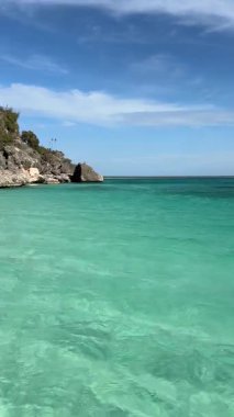 Boat excursion to Bahia De Las Aguilas, Pedernales, Dominican Republic. Crystal clear waters, amazing cliffs and rock in the sea. Touristic destination. Exclusive vacations.