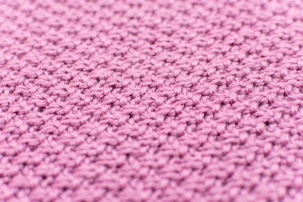 Рожевий в'язаний тканинний перлинний вовняний фон, крупним планом. Структура тканини з природною текстурою. Тканинний фон. В'язаний вовняний фон. Крупним планом . — стокове фото