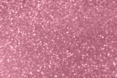 Yumuşak bokeh ışıkları olan pembe ışıltılı bir arka plan. Kutlamalar ve kadınsı temalar için mükemmel..