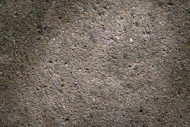 Arka plan ve açık hava sahneleri için uygun kaba bir zemin dokusunun engebeli yakın çekimi.