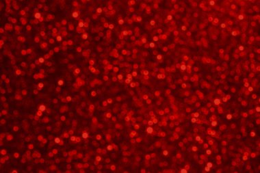 Işıl ışıl parıldayan kırmızı bokeh dokusu, festival kampanyaları ve kutlamalar için ideal..