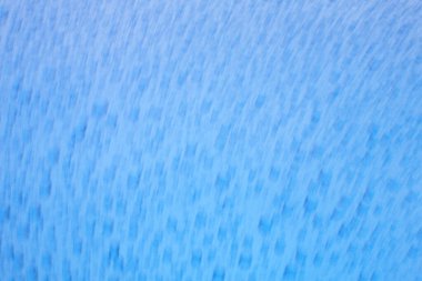 Canlı mavi desenli kumaş yüzeyi, dijital veya yazdırma projeleri için çok yönlü bir arkaplan olarak idealdir..