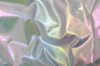 Pastel renkli yumuşak, yanardöner kumaş. Lüks ve sakin bir ruh haliyle parıldıyor..