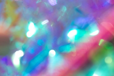 Yumuşak gökkuşağı renklerine ve parlayan ışığa sahip canlı soyut görüntü, dinamik arkaplan grafikleri için mükemmel.