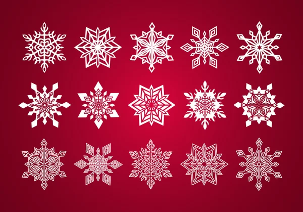 Uppsättning av olika fina spetsar snöflingor till jul på vin röd bakgrund — Stock vektor