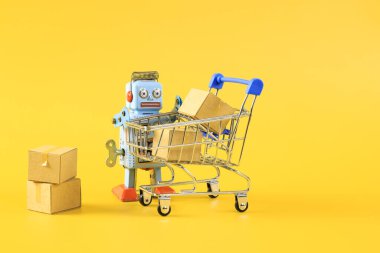 Klasik robot ve alışveriş arabası sembollü online alışveriş konsepti