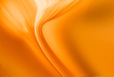 Yumuşak tahıl dokusu, pürüzsüz dalga şekilleri ve pürüzsüz sarı turuncu ton içeren modern soyut bir arka plan. Pankartlar, posterler, duvar kağıtları ve yaratıcı tasarımlar için ideal..