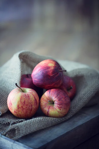 Apples on wooden background — Stock Photo, Image