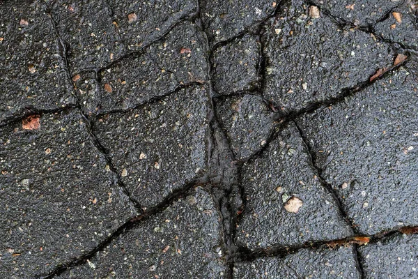 Σκούρα Υφή Ραγισμένης Ασφάλτου Σπασμένου Δρόμου — Φωτογραφία Αρχείου