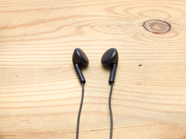 Black wired earphones — Stock Photo, Image