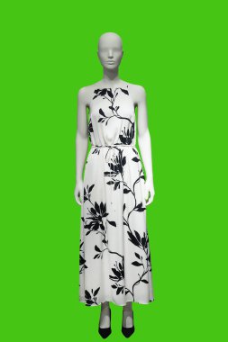 Yeşil arka planda izole edilmiş şık kıyafetler giyen bir kadın vitrin mankeni..