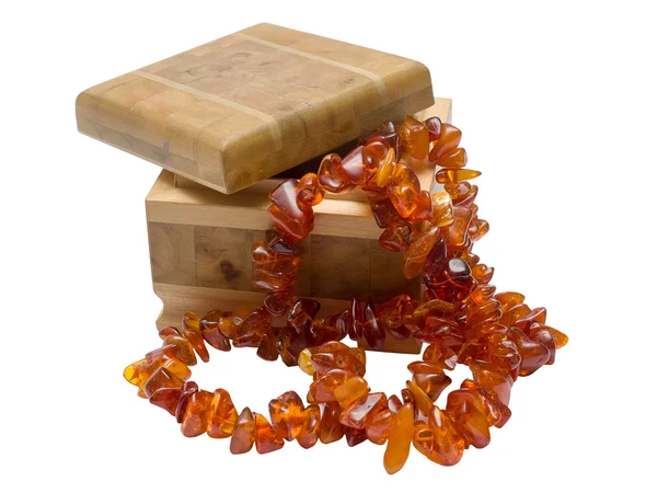 Wooden box with amber necklace — Stock Photo, Image