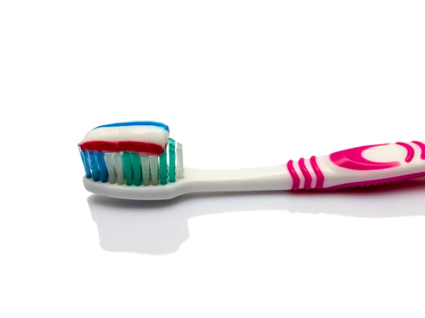 Toothbrush with toothpaste on white — Stock Photo, Image