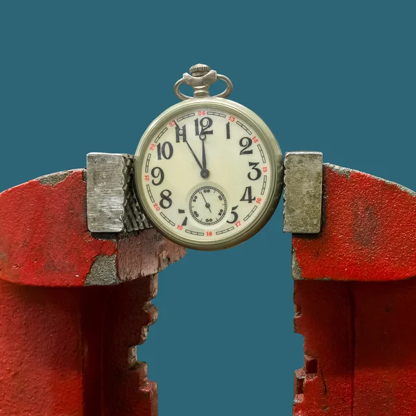 Pocket watch in vice grips — Stock Photo, Image