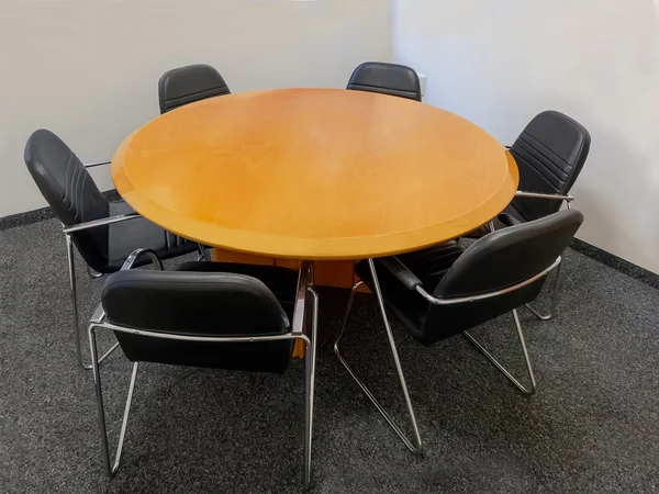 Meeting table and black chairs — Stock Photo, Image