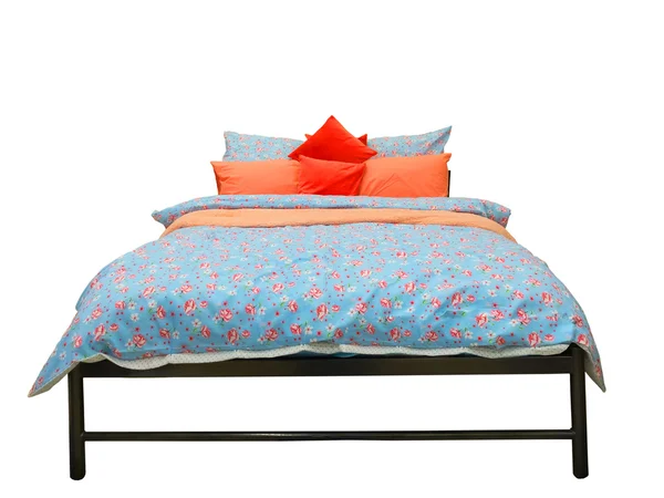 Bed with colorful duvet and cushions — Stock Photo, Image