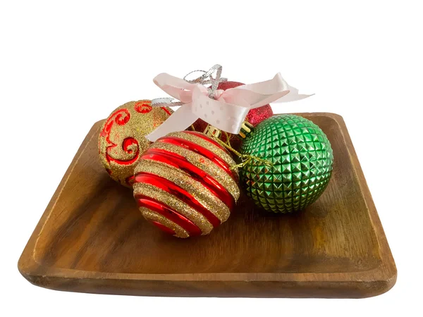 Christmas decorations on wooden plate — Stock Photo, Image