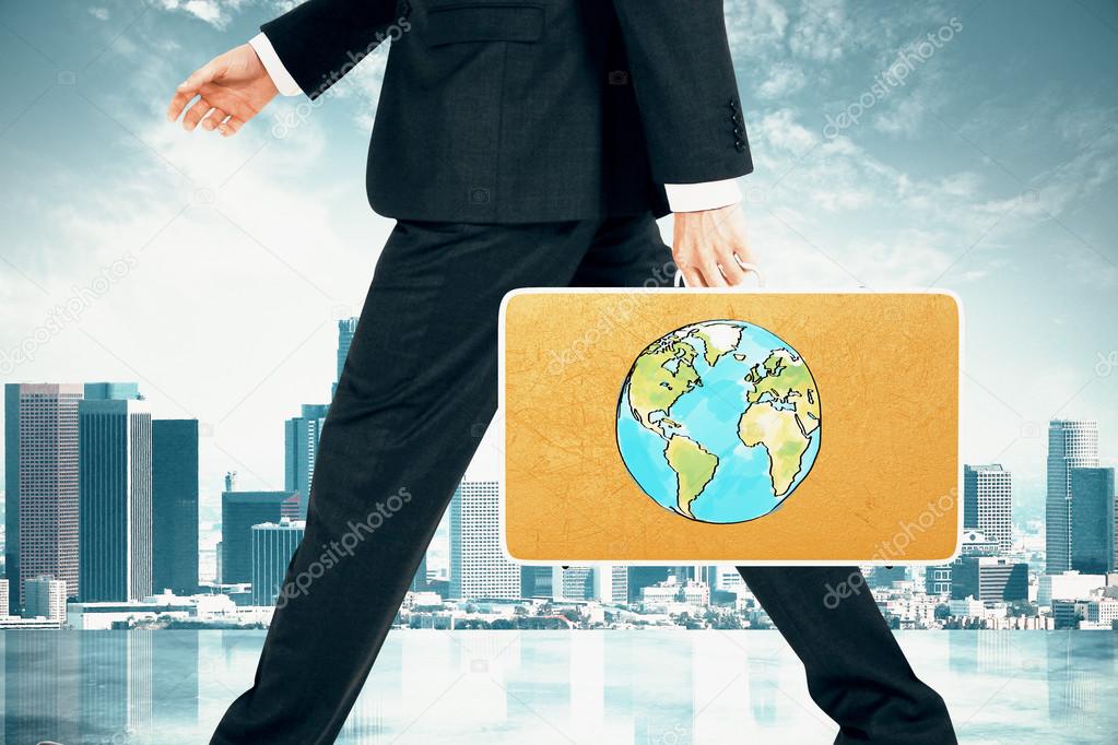 Businessman carries suitcase with Earth print