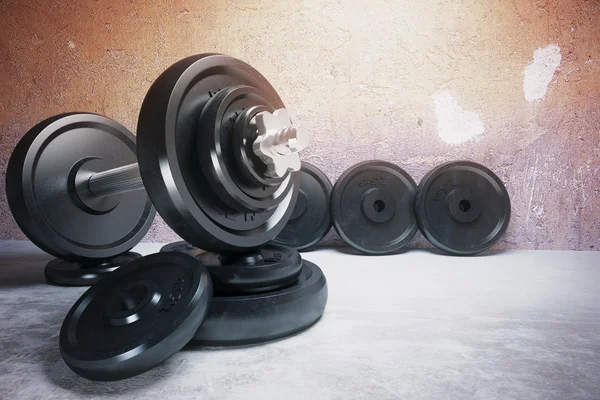 Dumbbell and row of plates — Stock Photo, Image