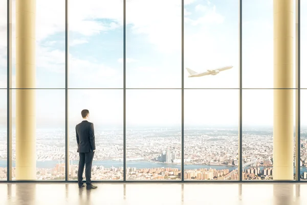 Interior with windows and businessman — Stock Photo, Image