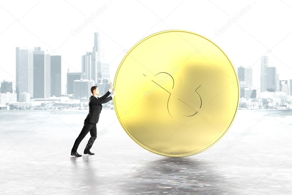 Businessman pushing dollar coin