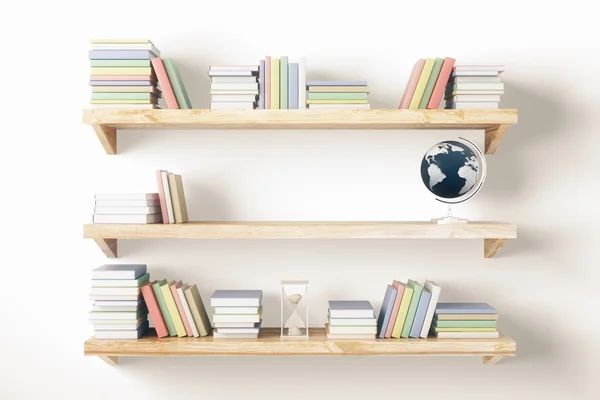 Shelves with books and other items — Stock Photo, Image