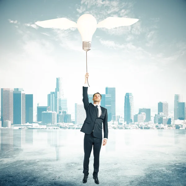 Idea concept lightbulb balloon city — Stock Photo, Image