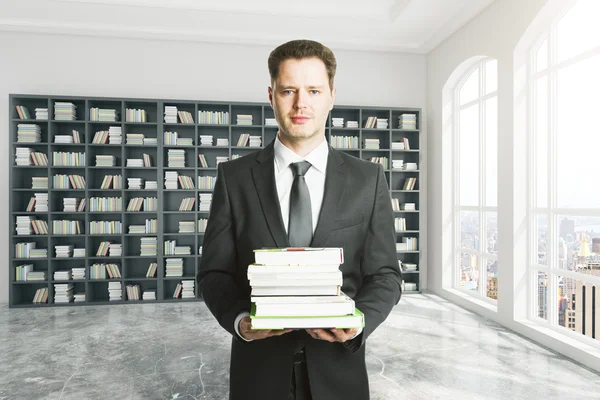 Education concept man in library — Stock Photo, Image