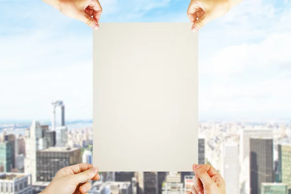 Hands holding blank paper — Stock Photo, Image