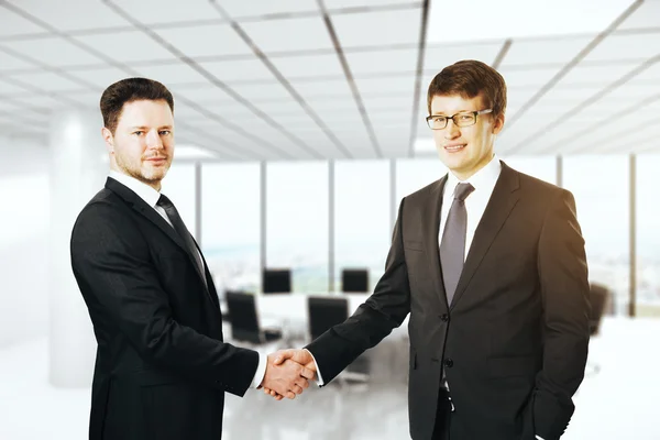 Businessmen shaking hands Stock Image