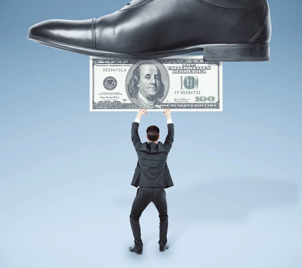 Businessman with dollar under shoe — Stock Photo, Image