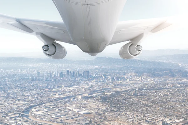 Airplane and cityscape — Stock Photo, Image