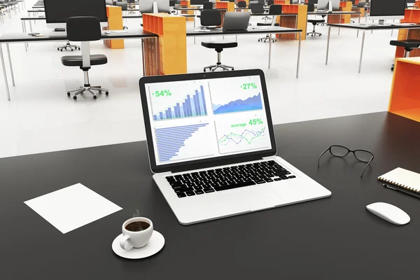Laptop com gráficos de negócios — Fotografia de Stock