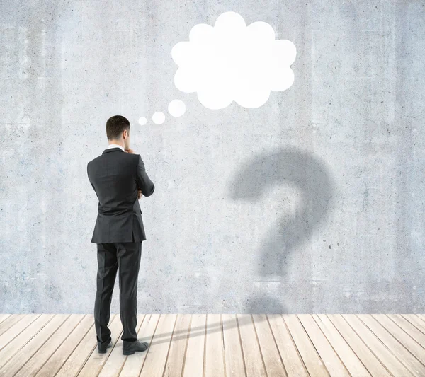 Man with question and thought cloud — Stock Photo, Image