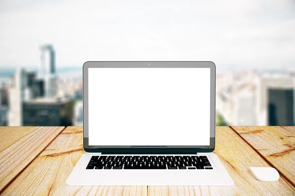 White laptop on city background — Stock Photo, Image