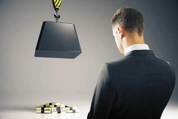 Businessperson looking at block above money — Stock Photo, Image