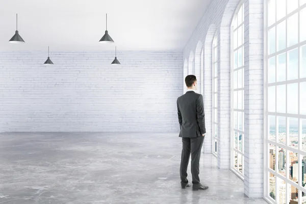 Businessman standing in interior — Stock Photo, Image