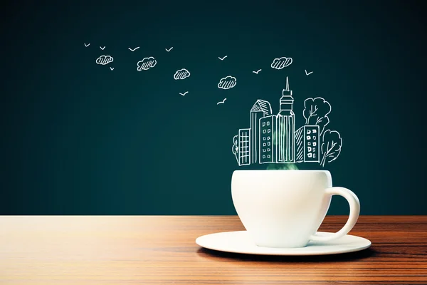 Filiżanka do kawy z rysunkiem miejskim — Zdjęcie stockowe