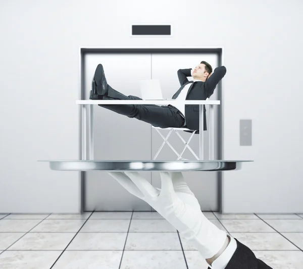 Relaxing man on elevator background — Stock Photo, Image