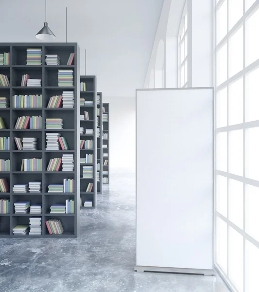 White ad stand in library — Stock fotografie