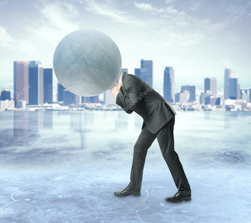Man with concrete sphere instead of head on city background. Burden concept