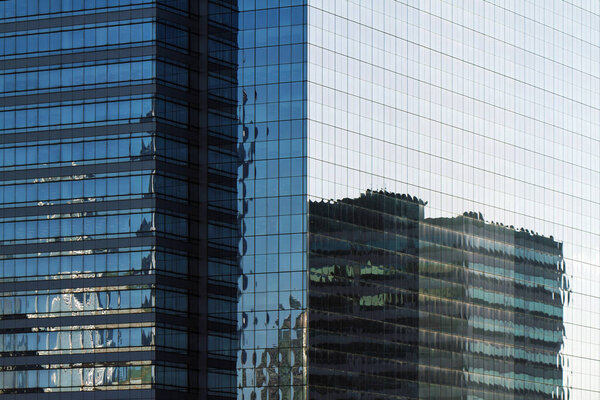Abstract office building windows with beautiful reflections, close up